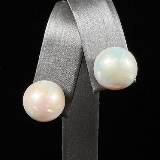 A pair of white South Seas pearl earrings with yellow gold push back friction posts.