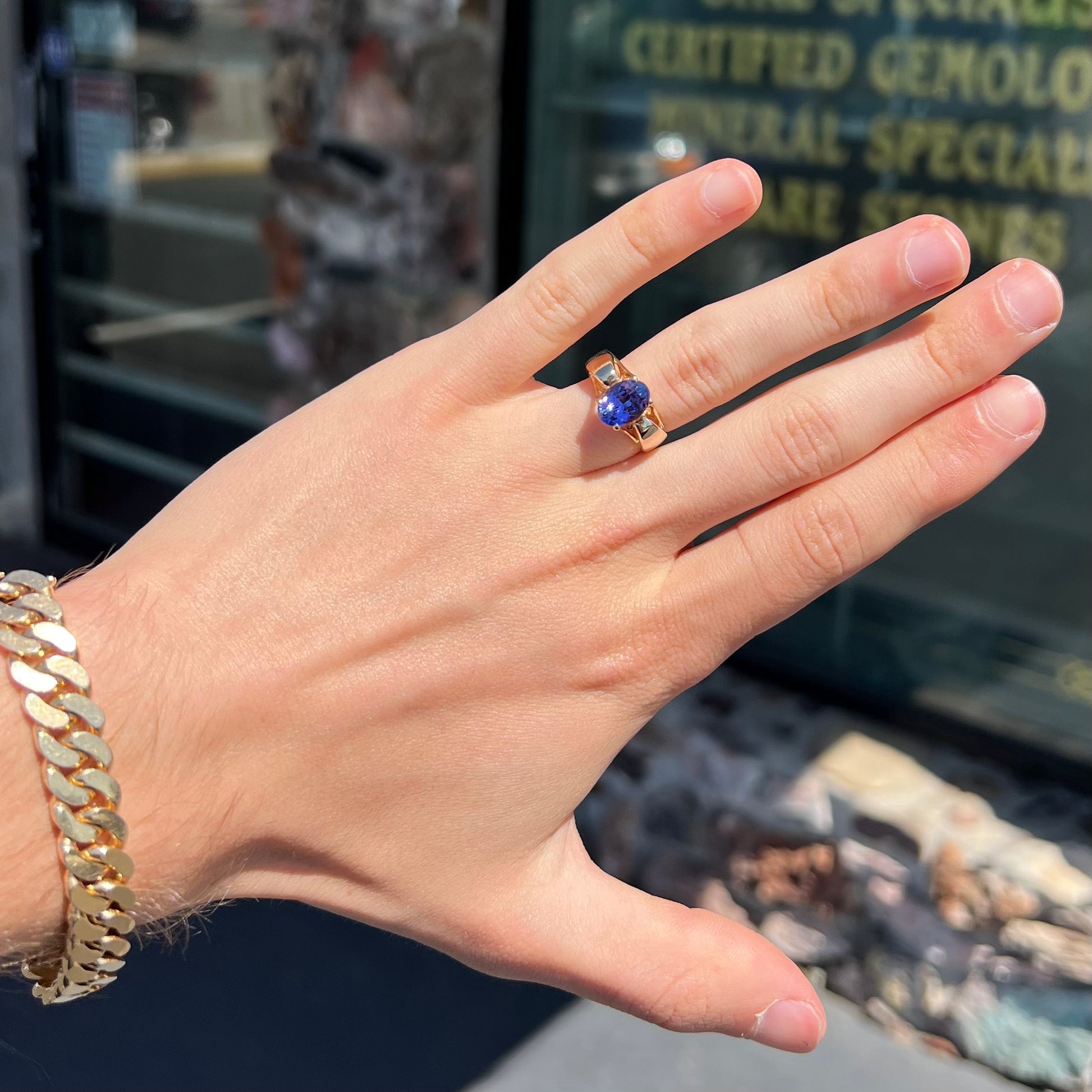 A ladies' oval cut tanzanite solitaire ring set in yellow gold.