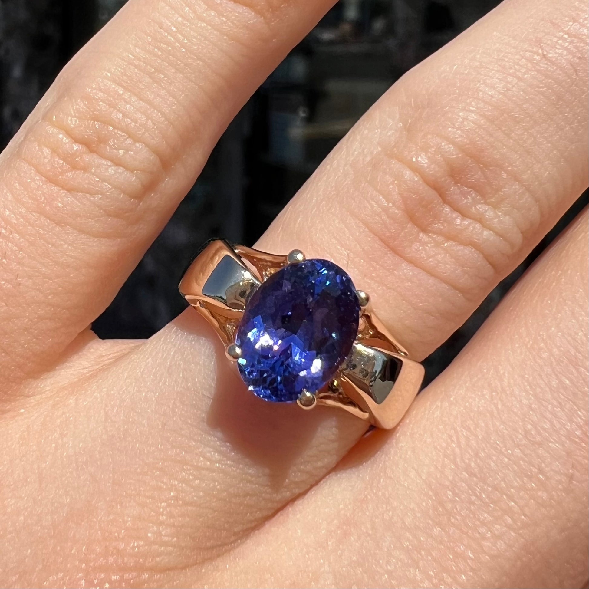 A ladies' oval cut tanzanite solitaire ring set in yellow gold.