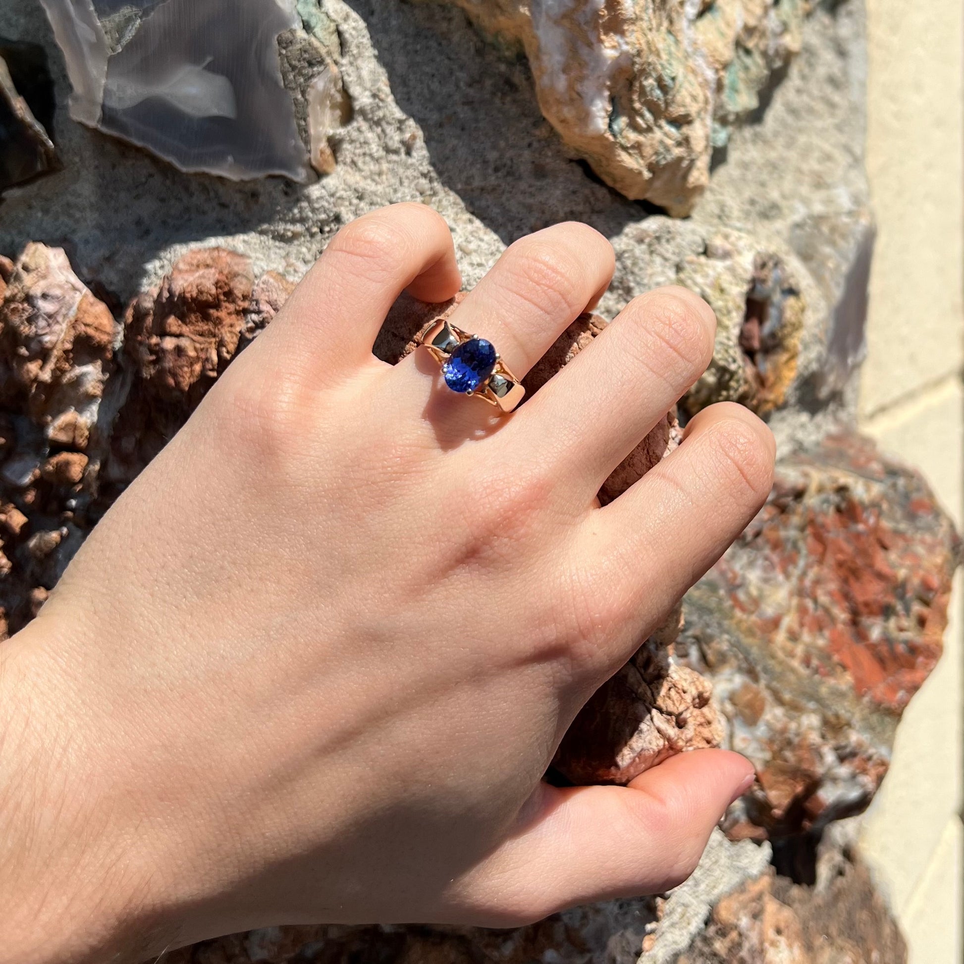 A ladies' oval cut tanzanite solitaire ring set in yellow gold.