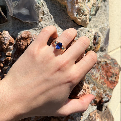 A ladies' oval cut tanzanite solitaire ring set in yellow gold.