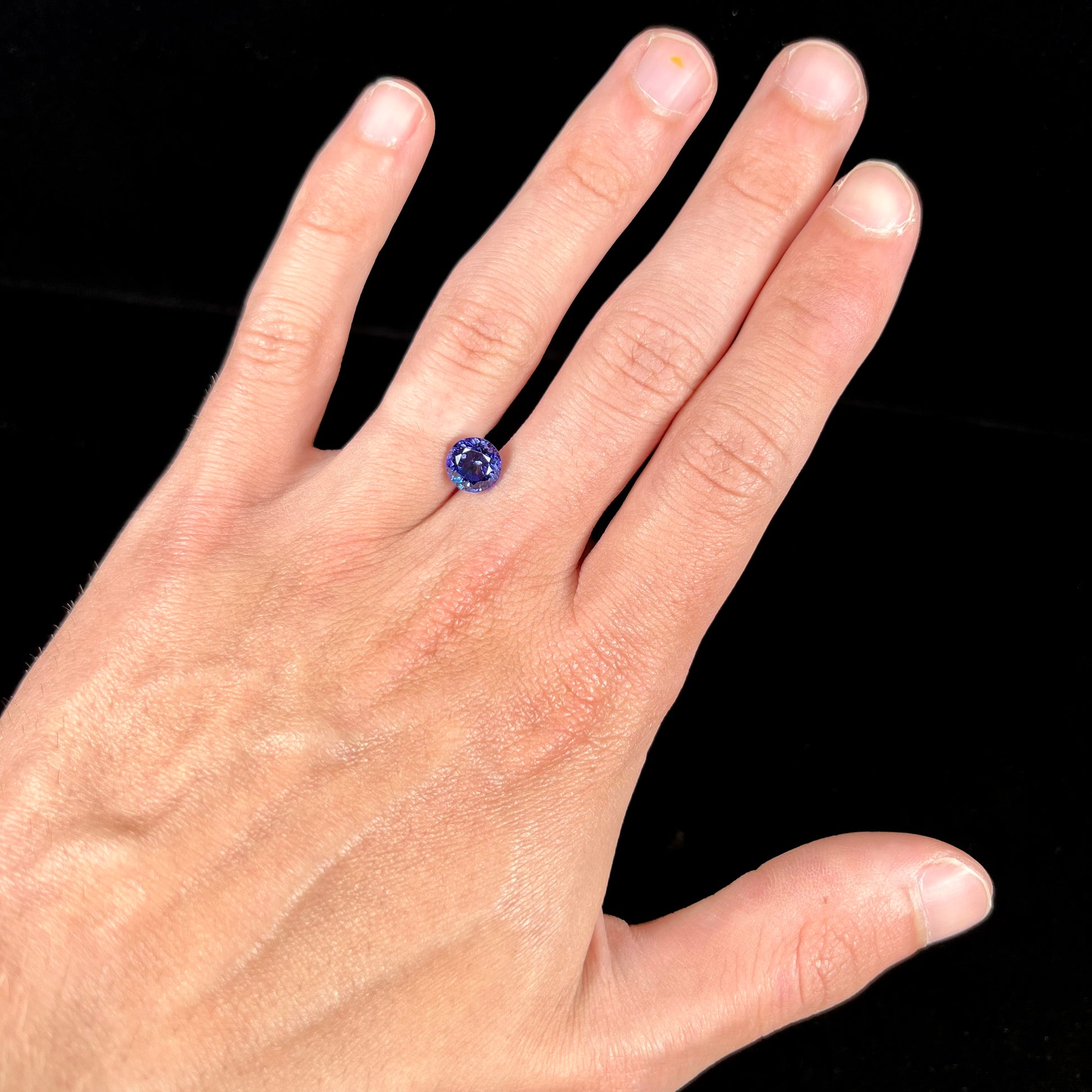 A loose, AAA grade, deep blue, round brilliant cut tanzanite stone.