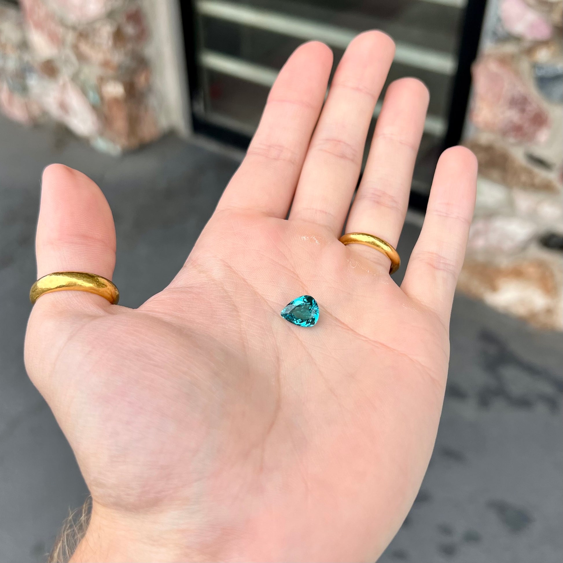 A loose, pear shaped green-blue indicolite tourmaline stone.