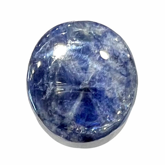 A loose, oval cabochon cut blue trapiche star sapphire stone.  The gem weighs 8.35 carats.