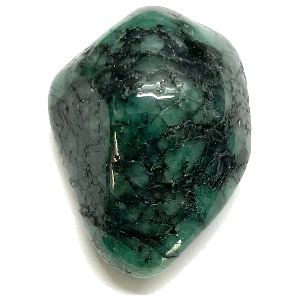 A tumble polished emerald stone.  The body color is dark green and has a black webbed matrix.