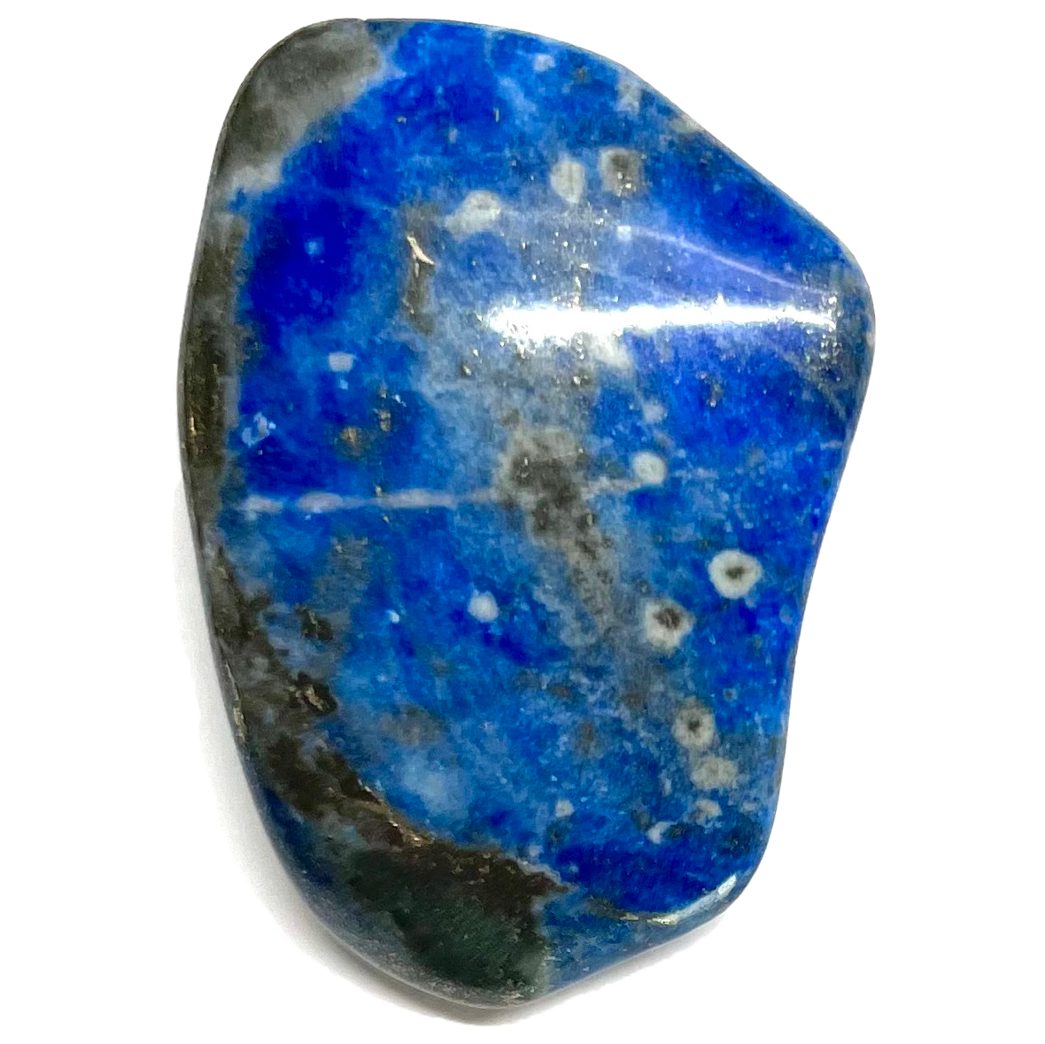 A tumbled lapis lazuli stone.  The material is dark blue with black matrix and golden pyrite speck inclusions.