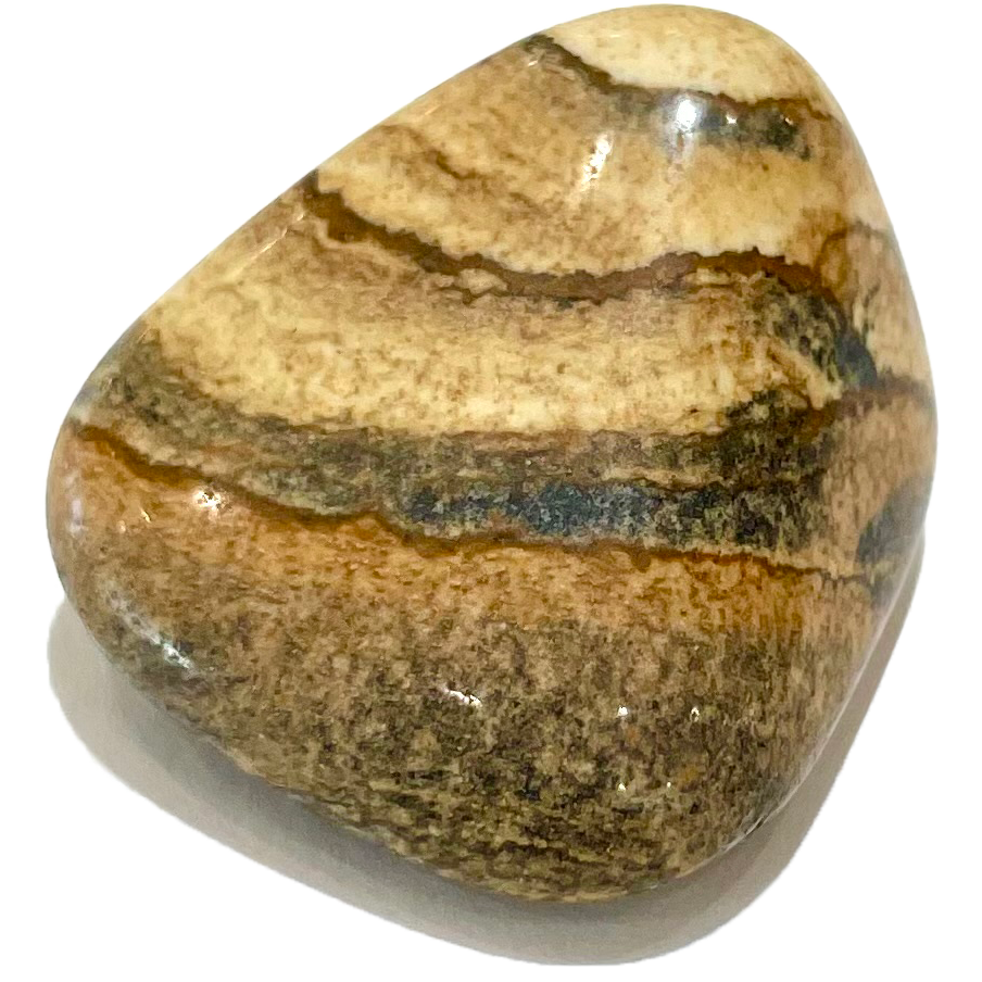A tumbled picture jasper stone.  The stone is a light, sandy brown color with black stripes.