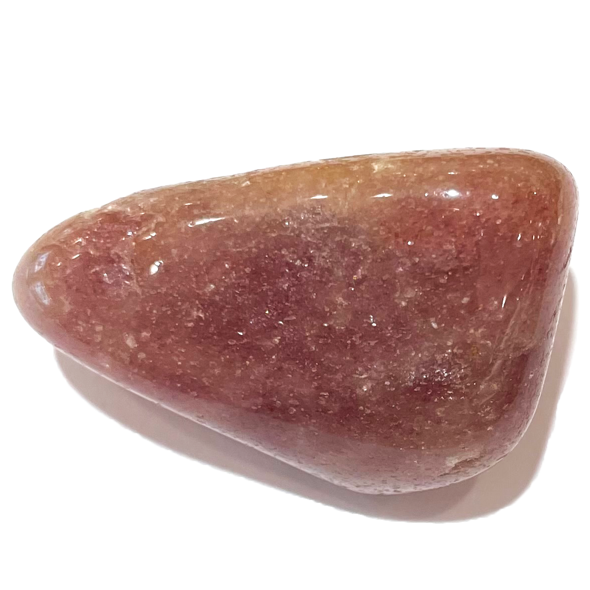 A tumble polished piece of pink aventurine stone.  The material is dark pink with reflective mica inclusions.