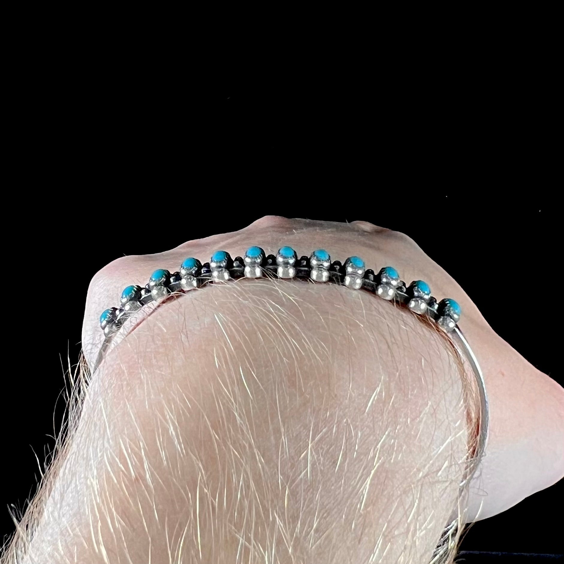A ladies' sterling silver Zuni Indian turquoise cuff bracelet.  The stones are oval cut Sleeping Beauty turquoise.