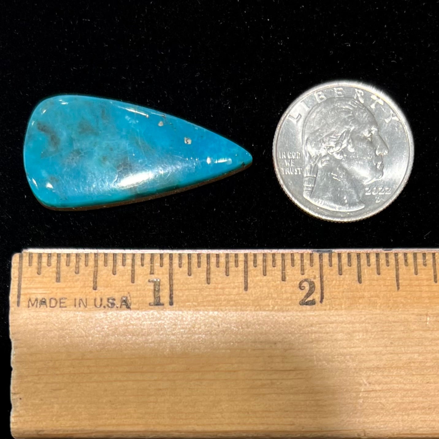 A loose, pear shaped turquoise stone from the Courtland-Gleeson mining district of Arizona.