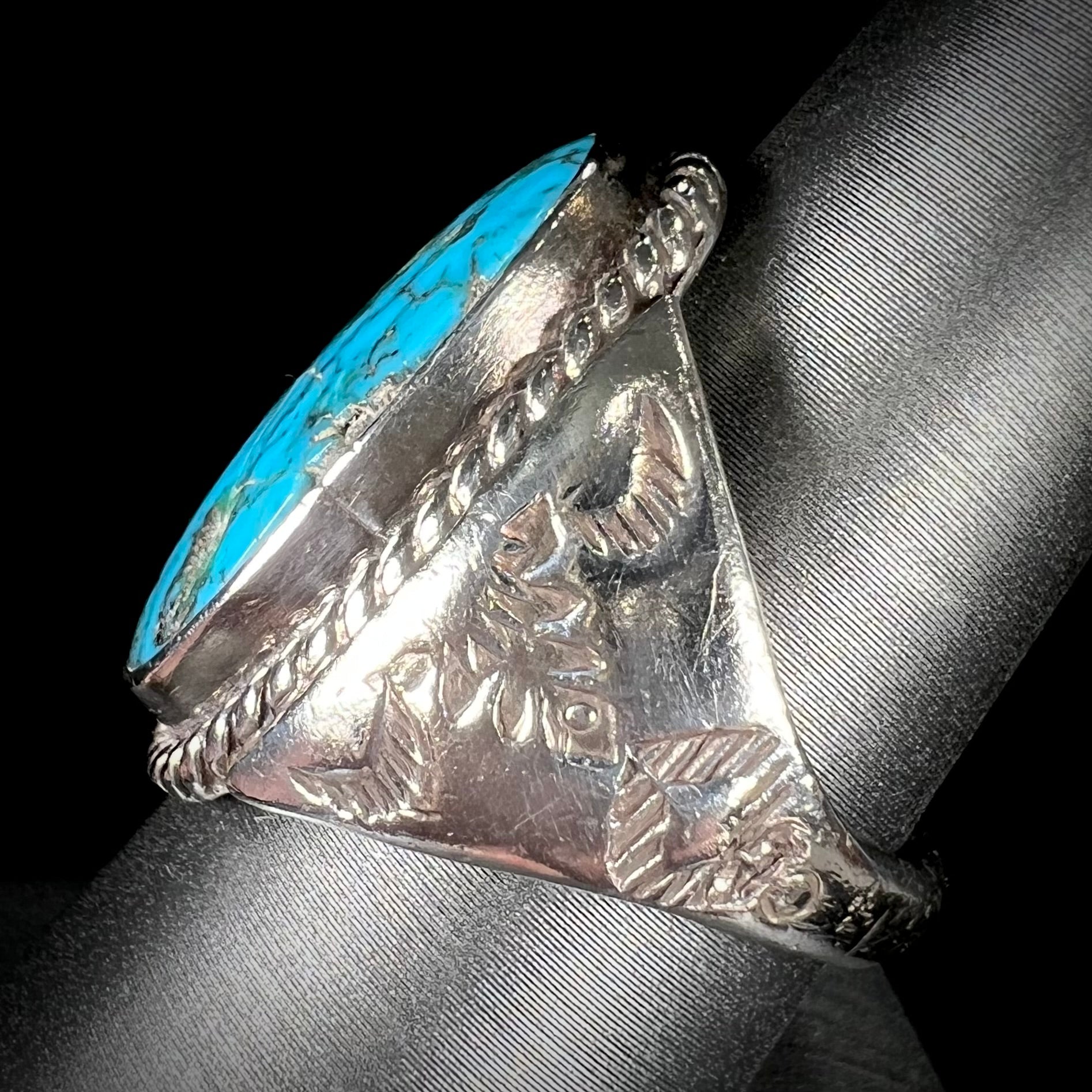 A men's sterling silver Morenci turquoise solitaire ring.  The ring has a Southwest Navajo style stamp pattern.