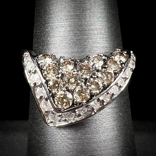 A ladies' white gold ring set with clusters of brown champagne and white diamonds.