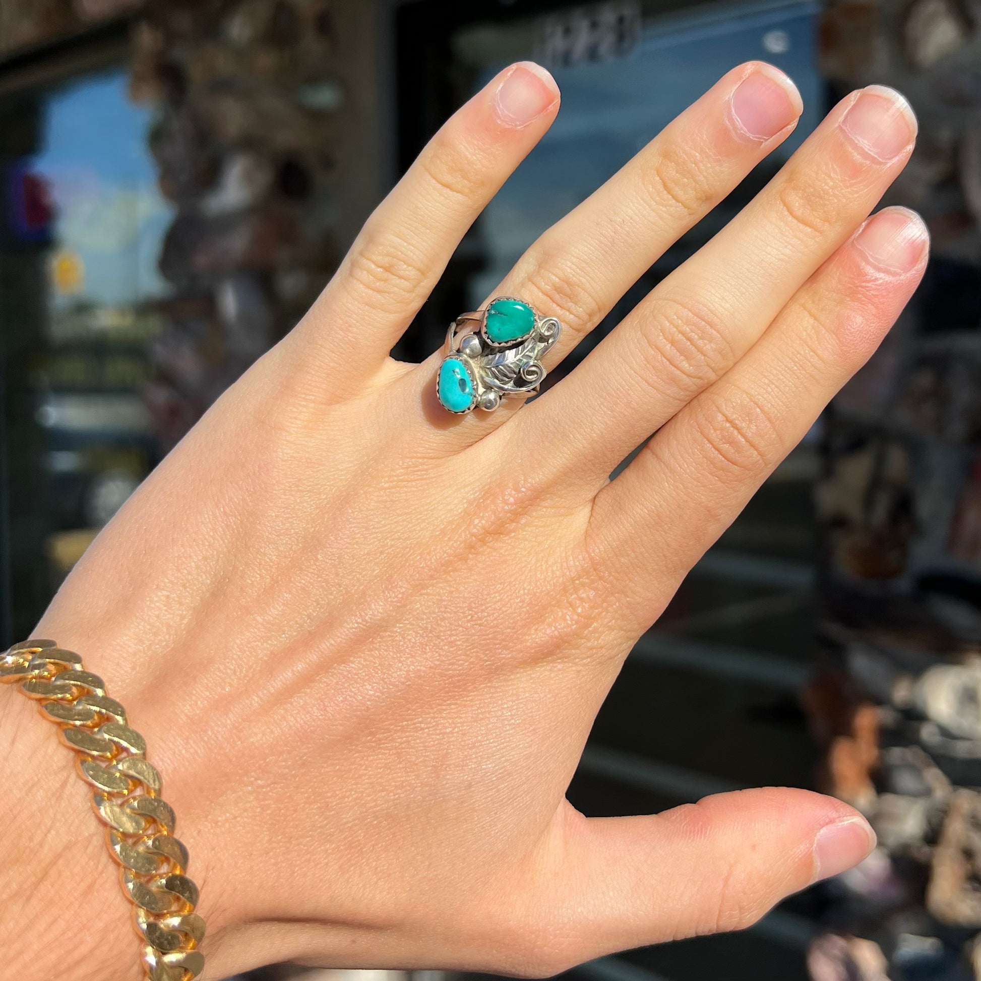 A ladies' Southwest style sterling silver ring set with Sleeping Beauty & Royston turquoise stones.