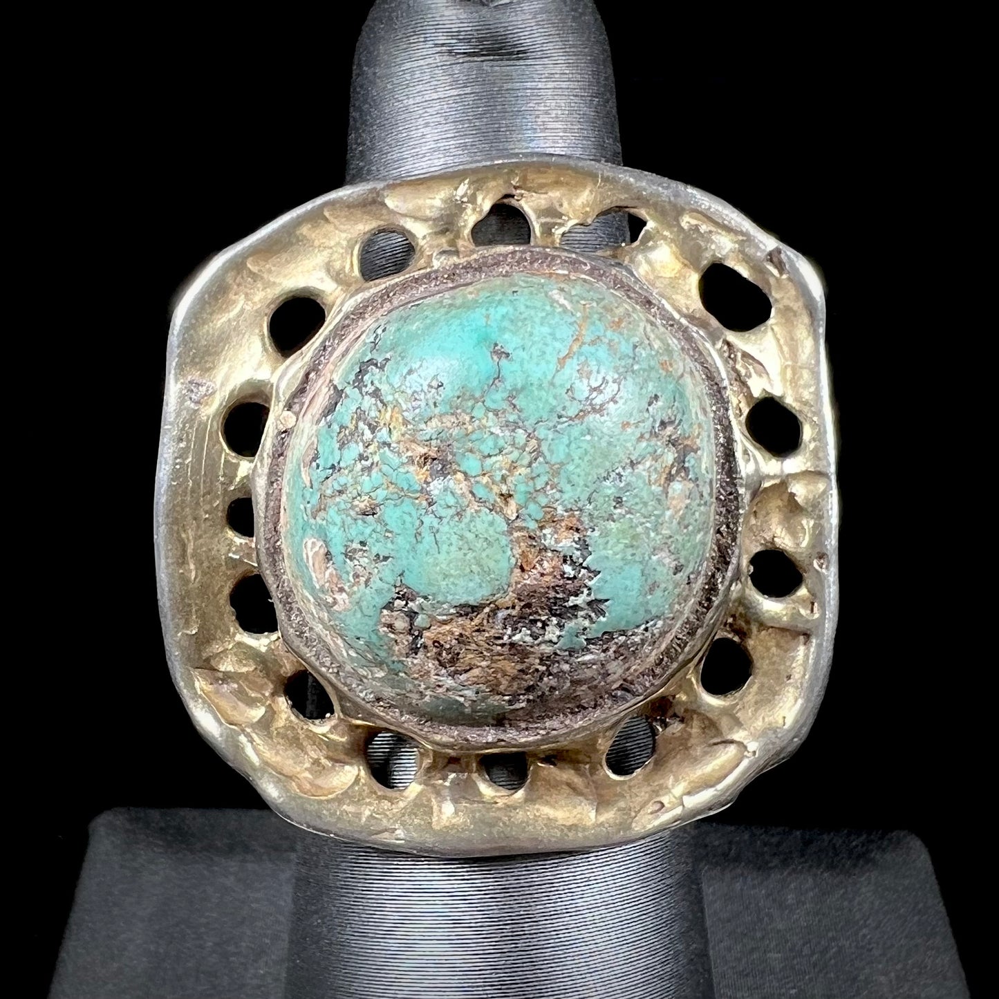 A unisex sterling silver ring with a gold wash, set with a natural, unstabilized Valley Blue turquoise stone.