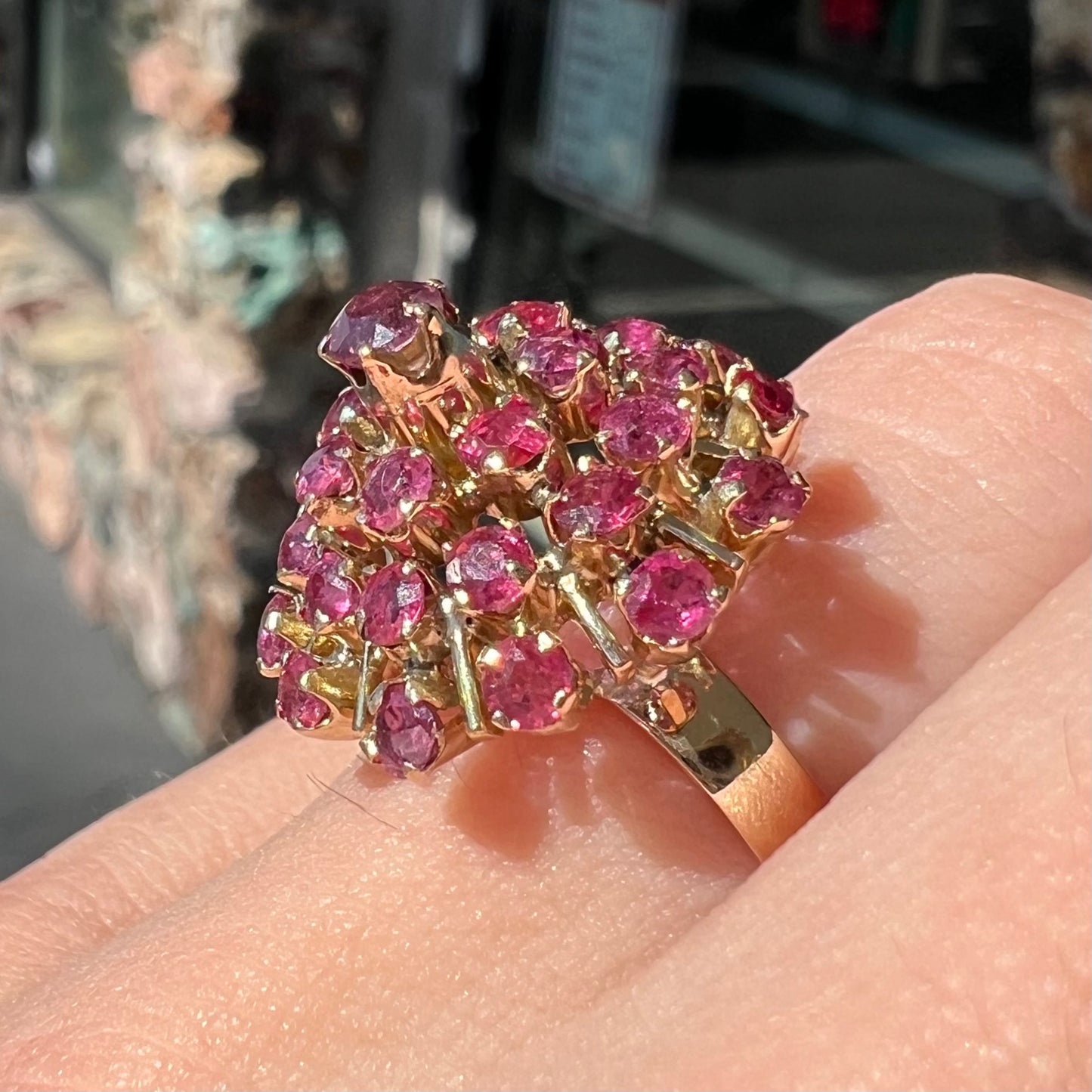 A ladies' vintage Thai princess ring set with round cut purplish red rubies.