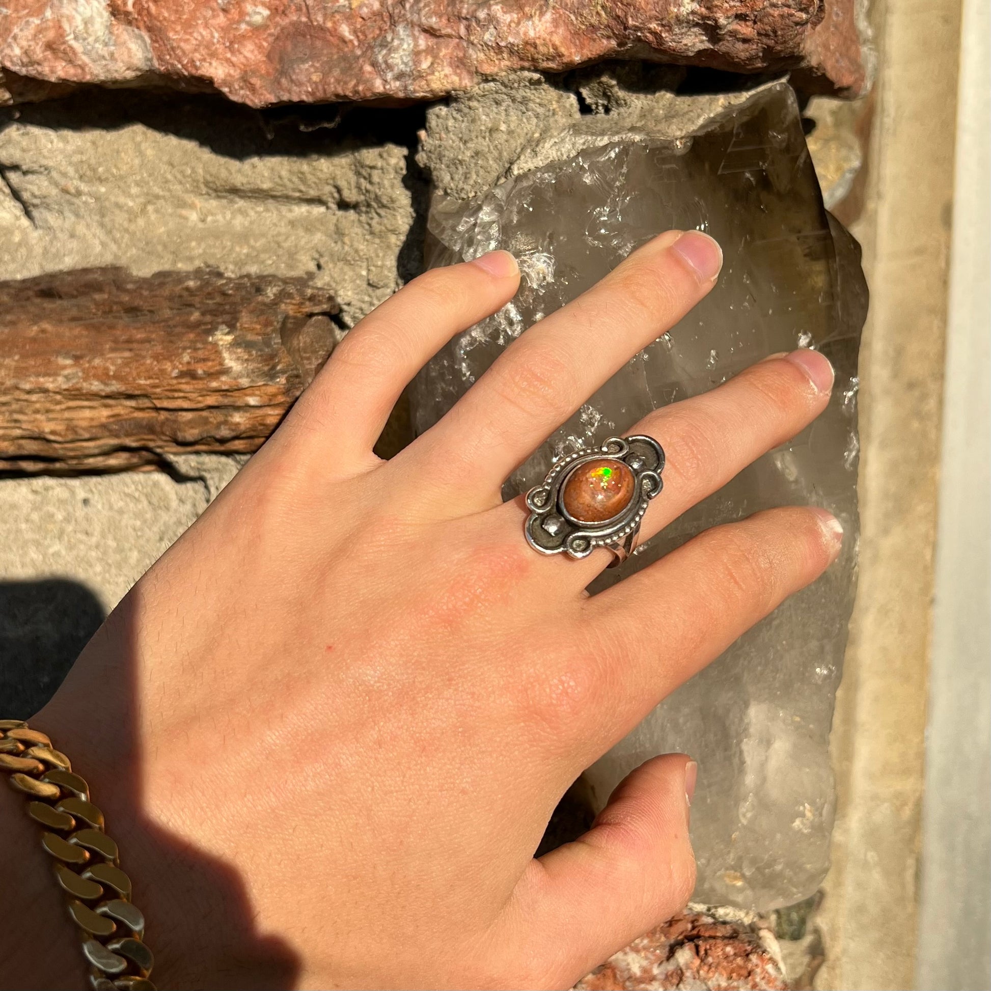 A vintage, Navajo style sterling silver ring set with an oval cabochon cut cantera fire opal stone.