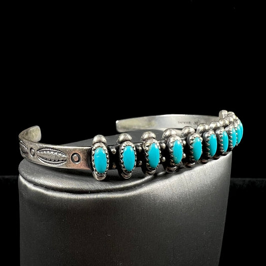 A ladies' sterling silver Zuni Indian turquoise cuff bracelet.  The stones are oval cut Sleeping Beauty turquoise.