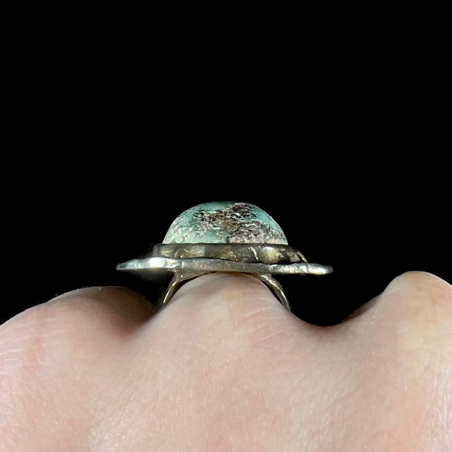 A unisex sterling silver ring with a gold wash, set with a natural, unstabilized Valley Blue turquoise stone.