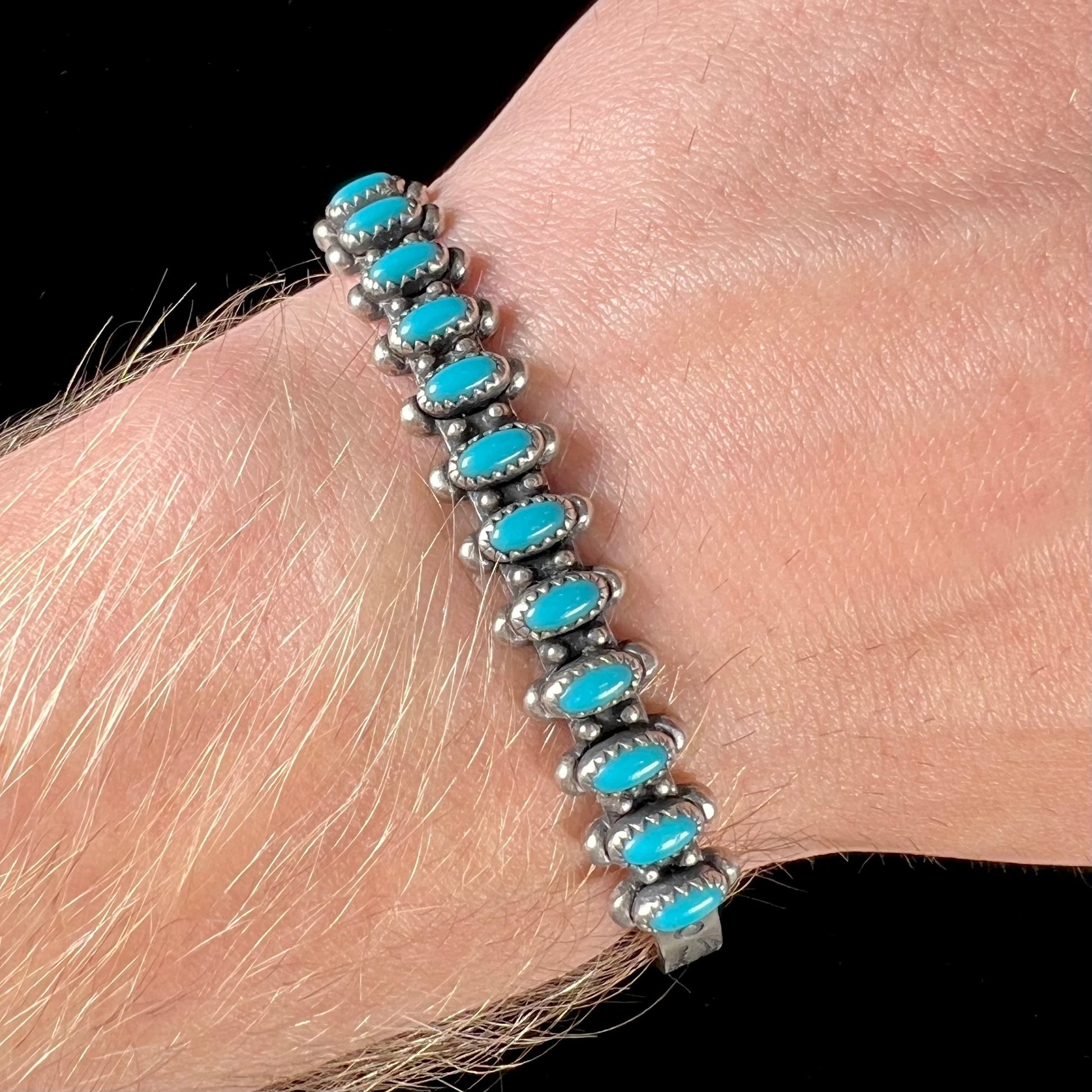 A ladies' sterling silver Zuni Indian turquoise cuff bracelet.  The stones are oval cut Sleeping Beauty turquoise.