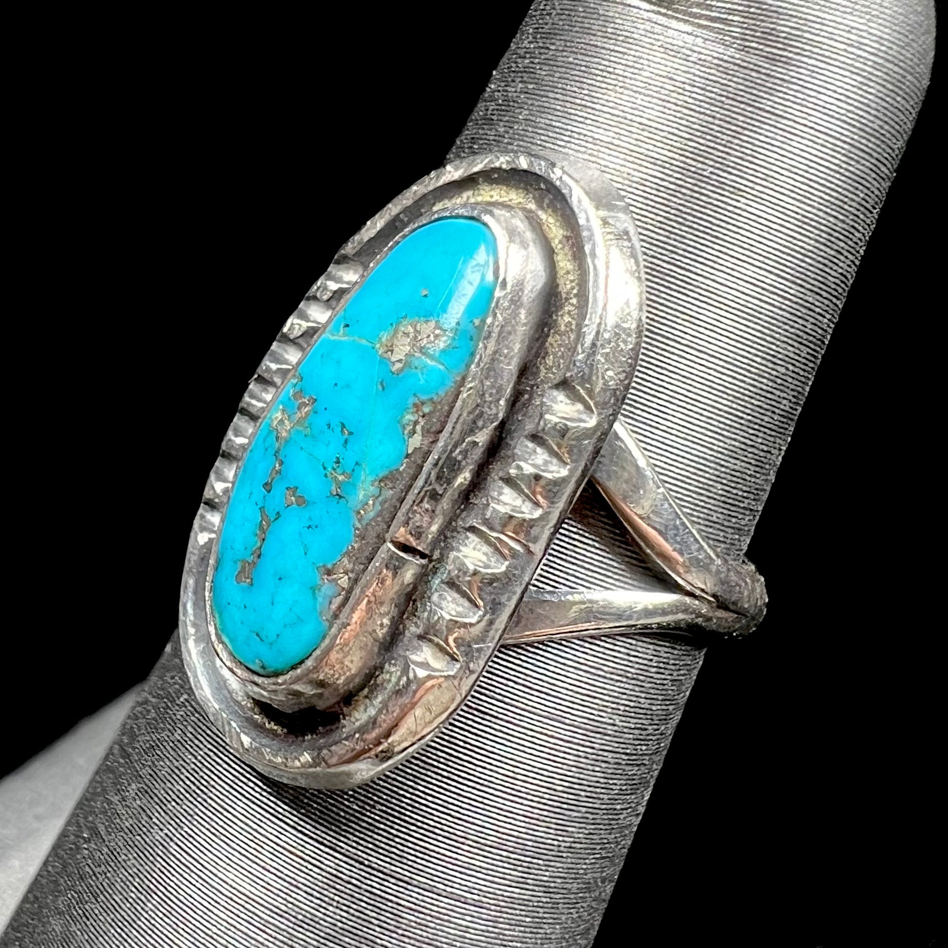 A handmade sterling silver Navajo style ring set with a Morenci turquoise stone.