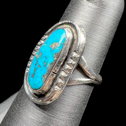 A handmade sterling silver Navajo style ring set with a Morenci turquoise stone.