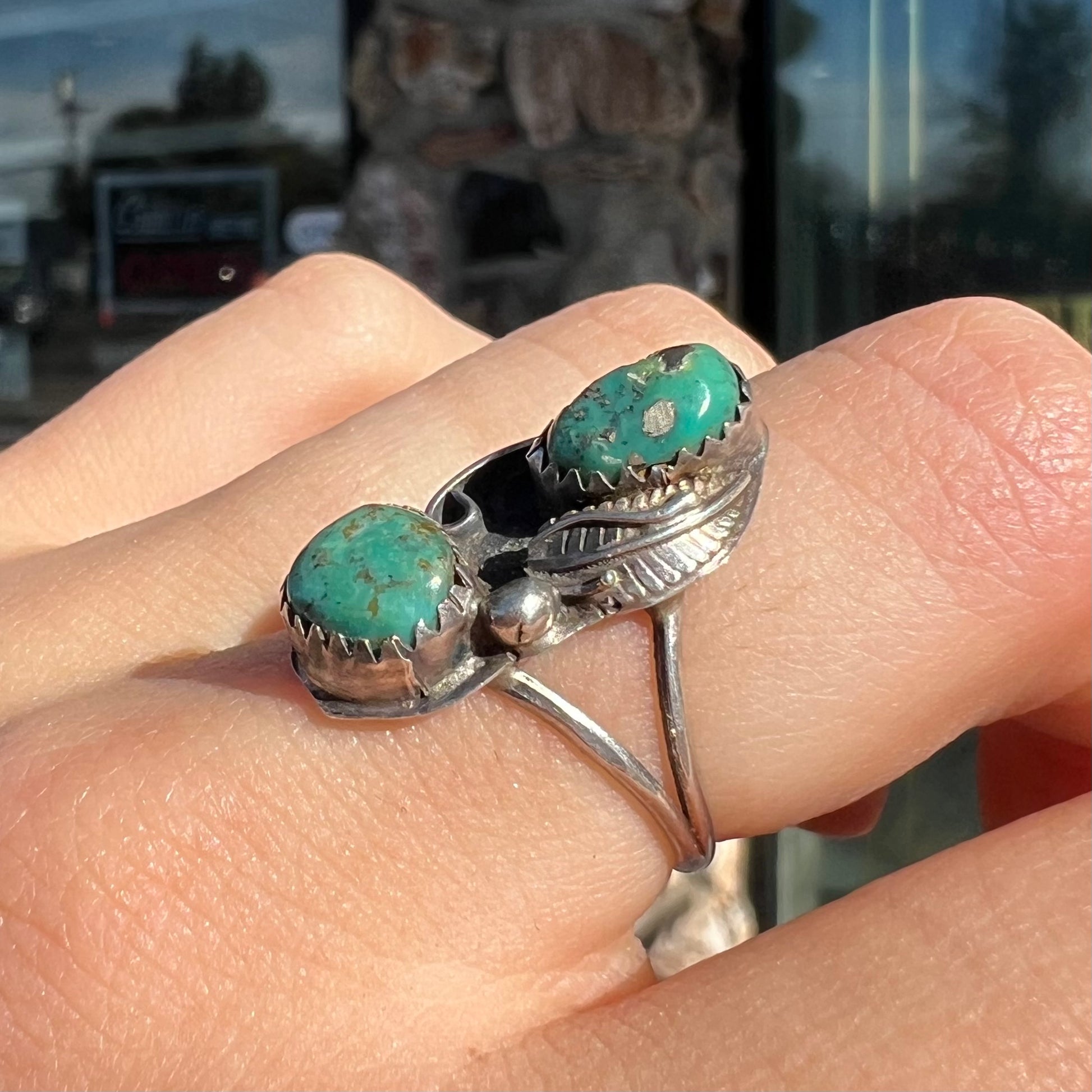 A ladies' sterling silver and green Morenci turquoise ring.  The ring is handmade in the Navajo style.
