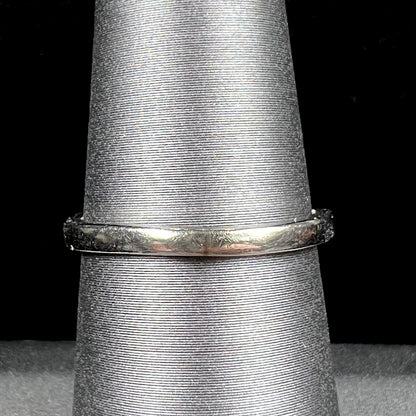 A ladies' estate white gold ruby ring set with a diamond accent stone.