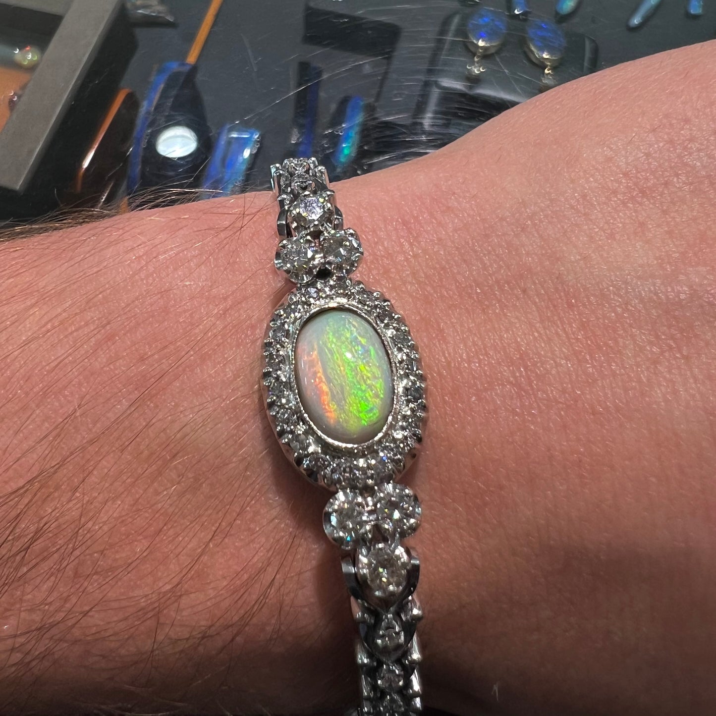 A ladies' vintage, 1930's natural opal bracelet set with accent diamonds in white gold.