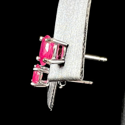 A pair of natural Burma ruby stud earrings set in white gold.  The rubies are a purplish red color.