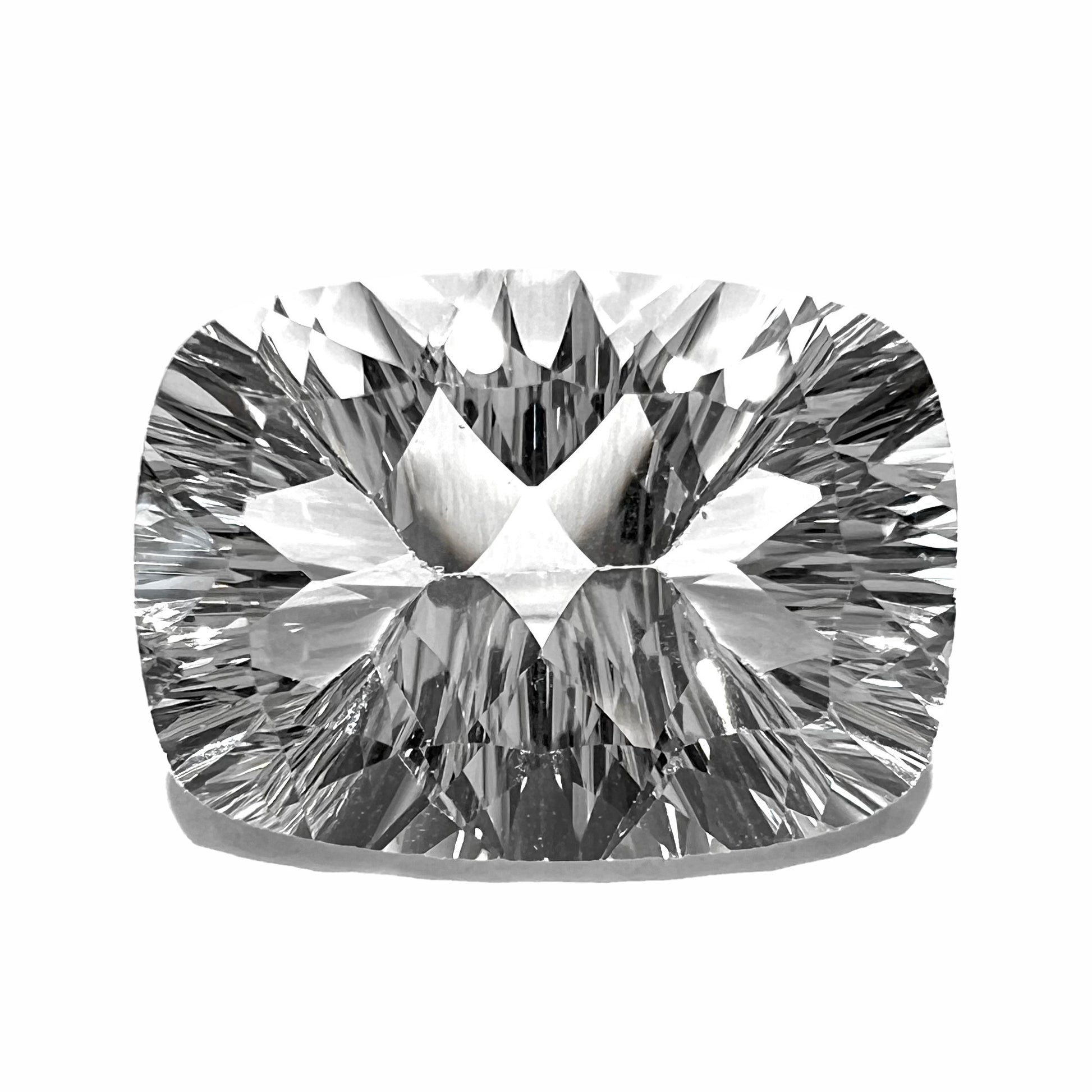 A loose, cushion laser cut white topaz stone.