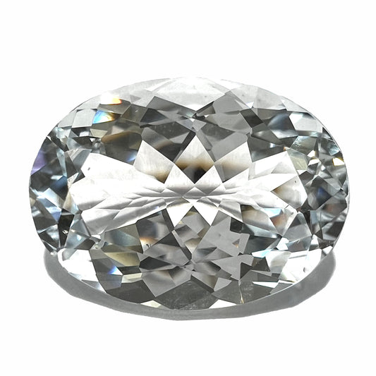 A loose, faceted oval cut white topaz gemstone.  The stone is large in size.