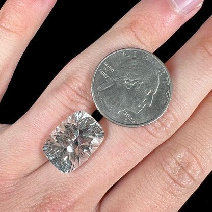 A loose, cushion laser cut white topaz stone.