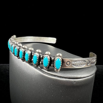 A ladies' sterling silver Zuni Indian turquoise cuff bracelet.  The stones are oval cut Sleeping Beauty turquoise.