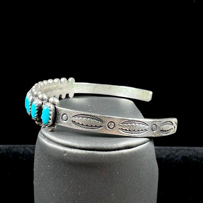 A ladies' sterling silver Zuni Indian turquoise cuff bracelet.  The stones are oval cut Sleeping Beauty turquoise.