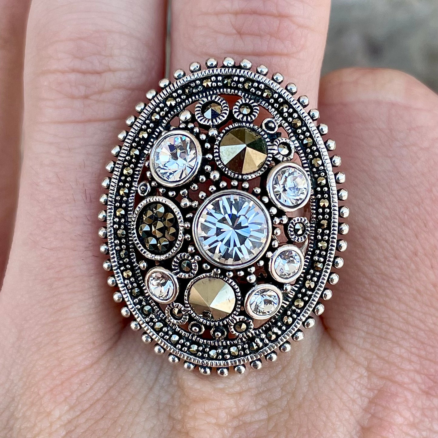 Silver Steam Punk style gear ring set with marcasite and round faceted glass stones.