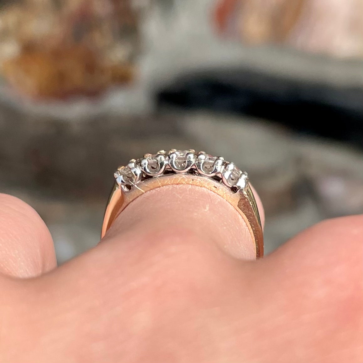 A vintage ladies' five-stone round cut diamond yellow gold wedding band