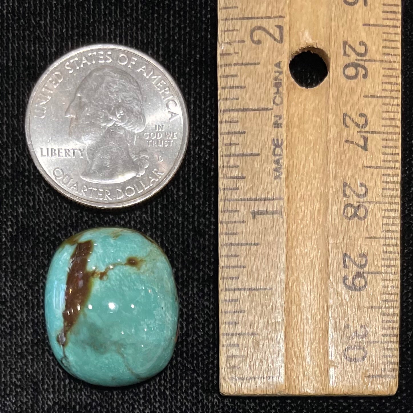 A loose, cushion shaped cabochon cut turquoise stone from Royston District, Nevada.