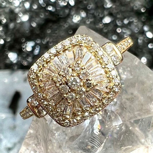 A 1930's style yellow gold diamond cluster ring set with round and baguette cut diamonds.