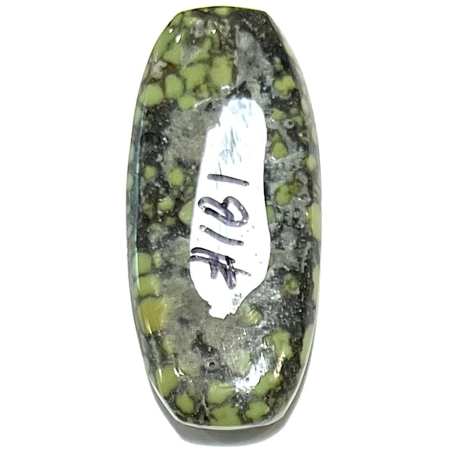A loose, cabochon cut green turquoise from the Number 8 Mine in Lander County, Nevada.