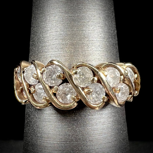 A ladies' estate yellow gold band set with 1 total carat of round brilliant cut diamonds.