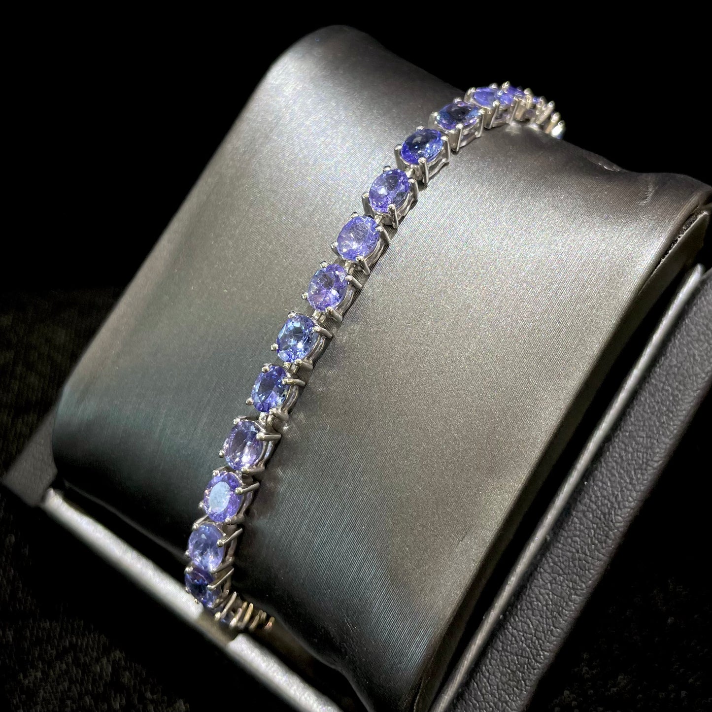 Denim blue violet tanzanite tennis bracelet in silver.