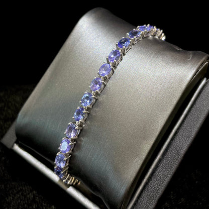 Denim blue violet tanzanite tennis bracelet in silver.