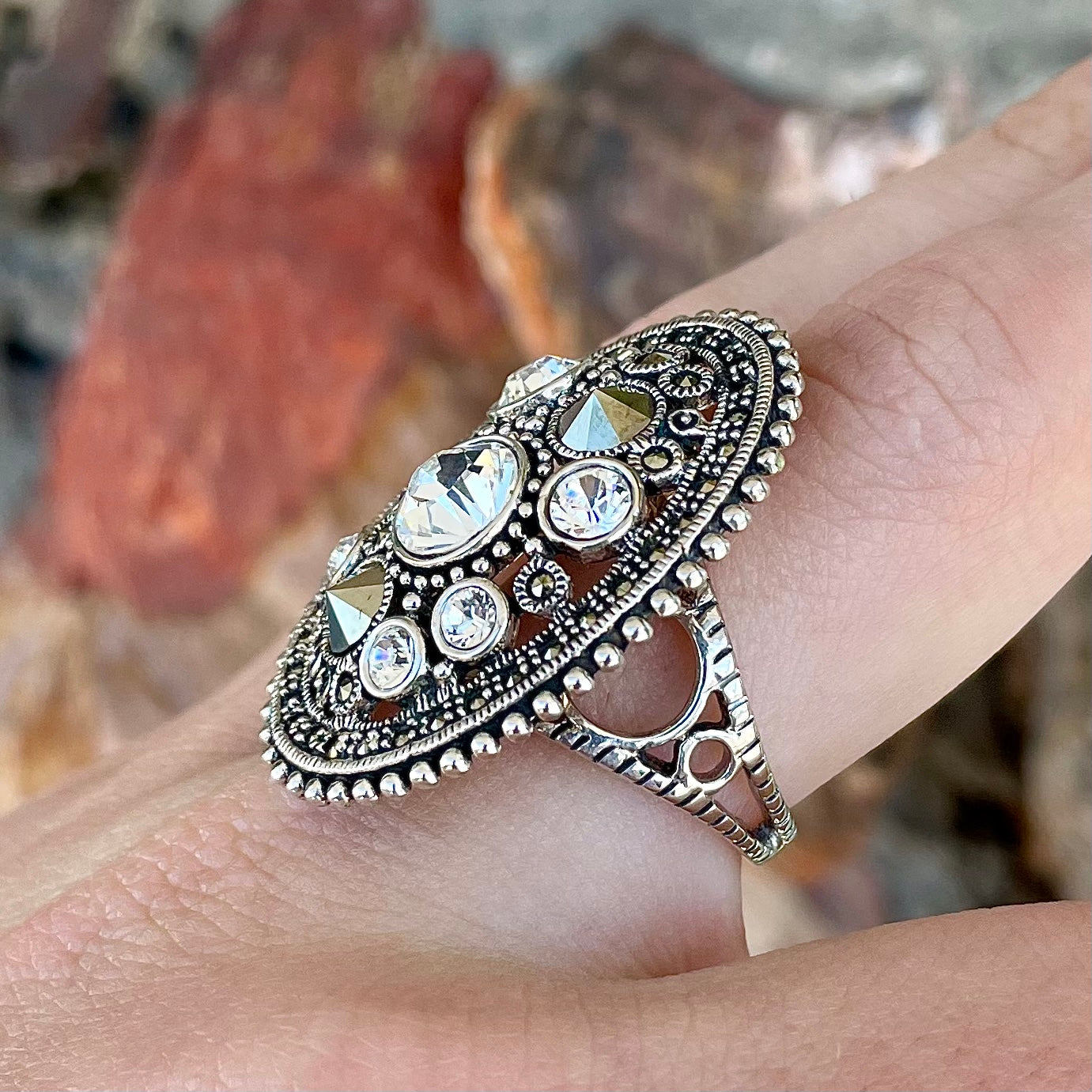 Silver Steam Punk style gear ring set with marcasite and round faceted glass stones.