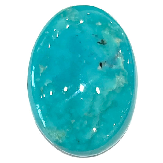 A loose, oval cabochon cut blue turquoise stone from Royston Mining District, Nevada.