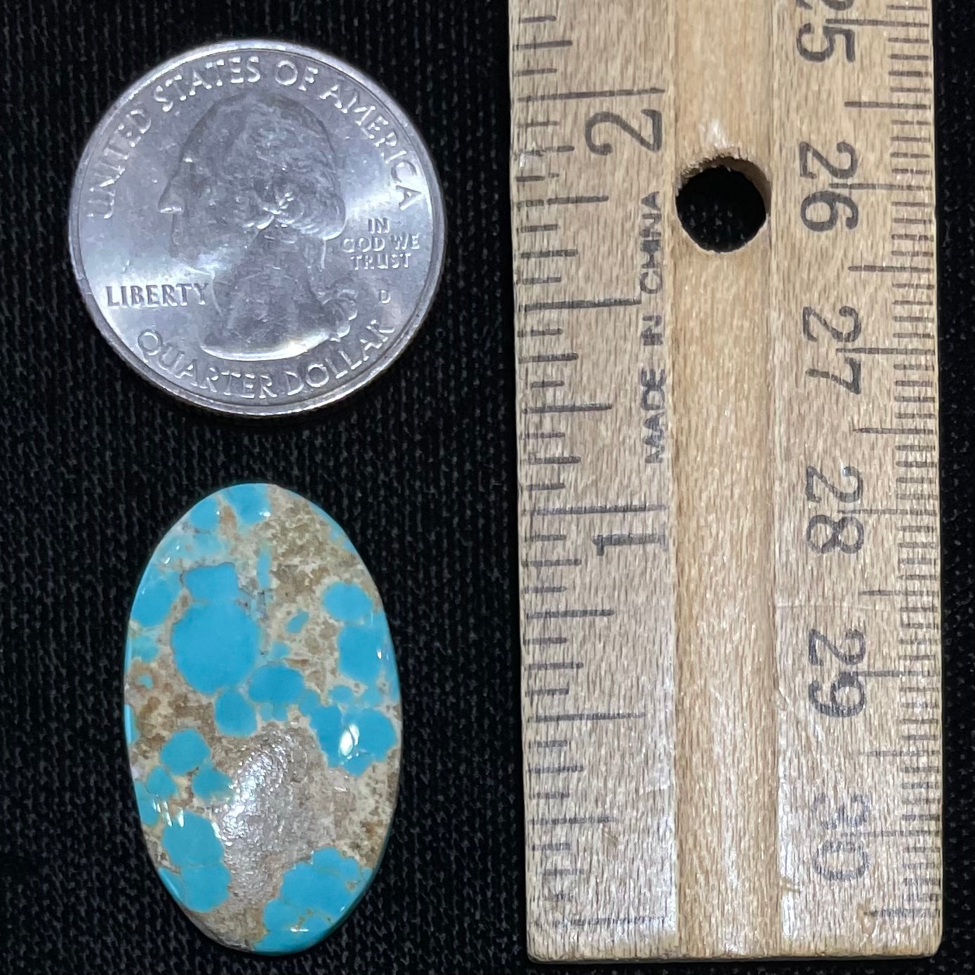 An oval cabochon cut loose Fox turquoise stone.