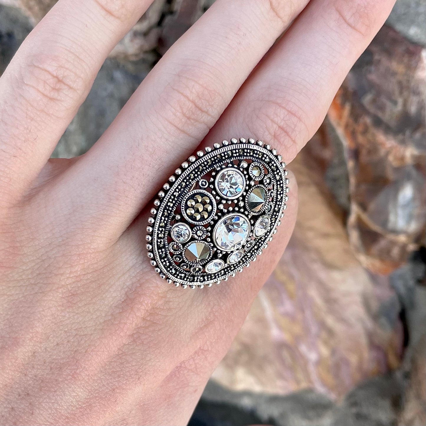 Silver Steam Punk style gear ring set with marcasite and round faceted glass stones.