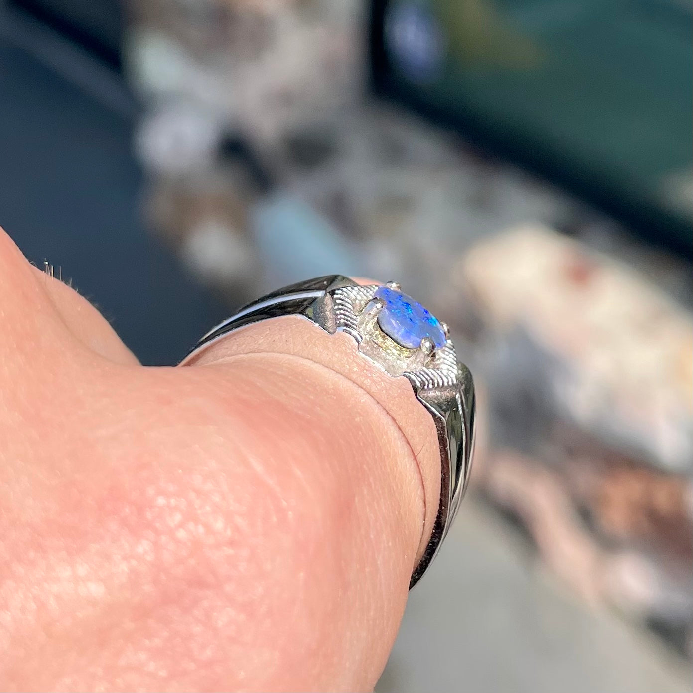 A round black crystal opal solitaire sterling silver men's ring.