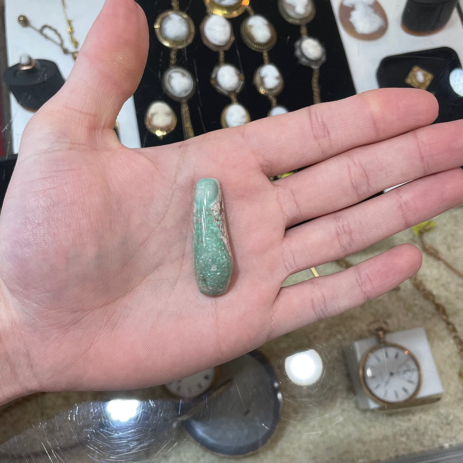 A loose, polished variscite stone from Utah, USA.
