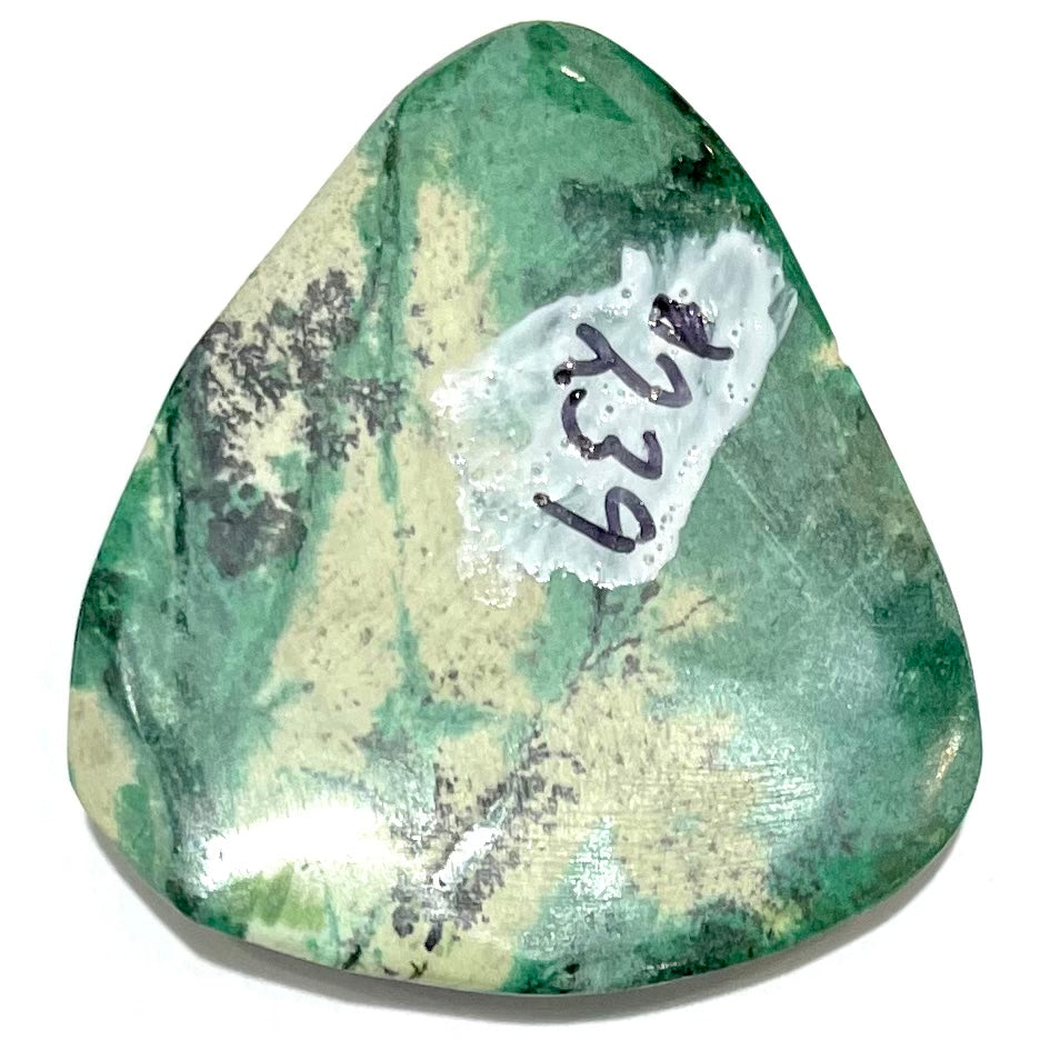 A loose, triangular cabochon cut variscite stone from Utah, USA.