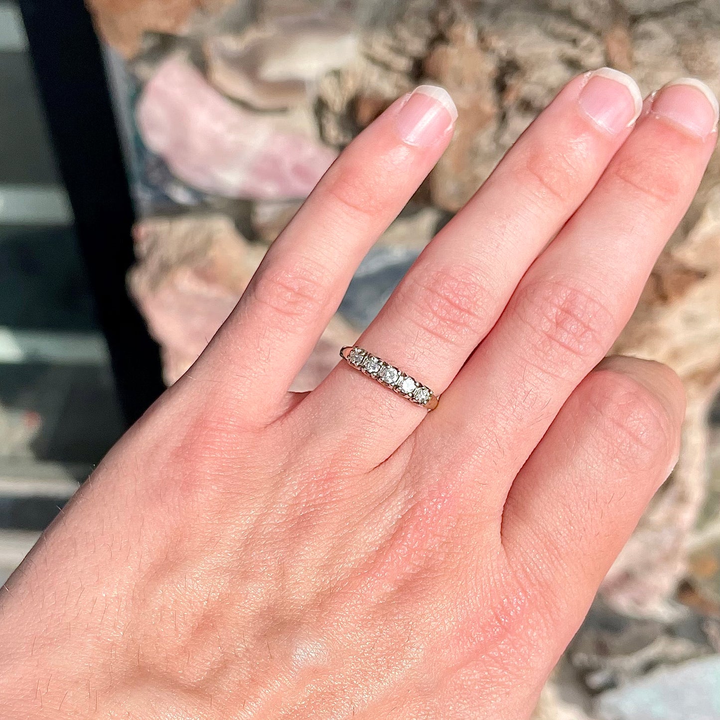 A vintage ladies' five-stone round cut diamond yellow gold wedding band